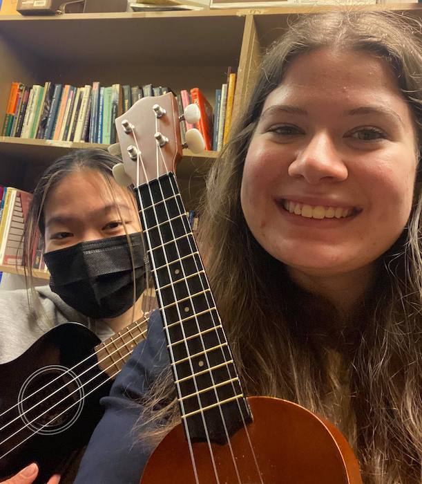 2 UVSMEA students holding ukuleles and smiling